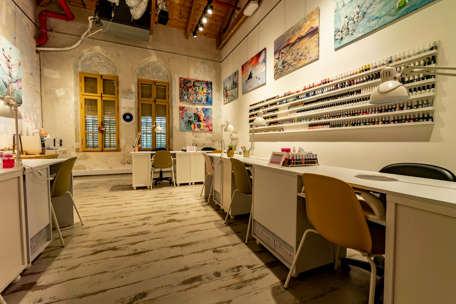 a nail salon with a lot of manicures on the walls